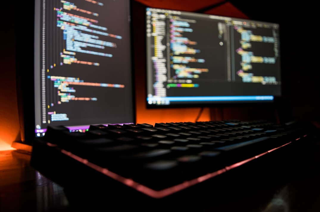 student coding at desk