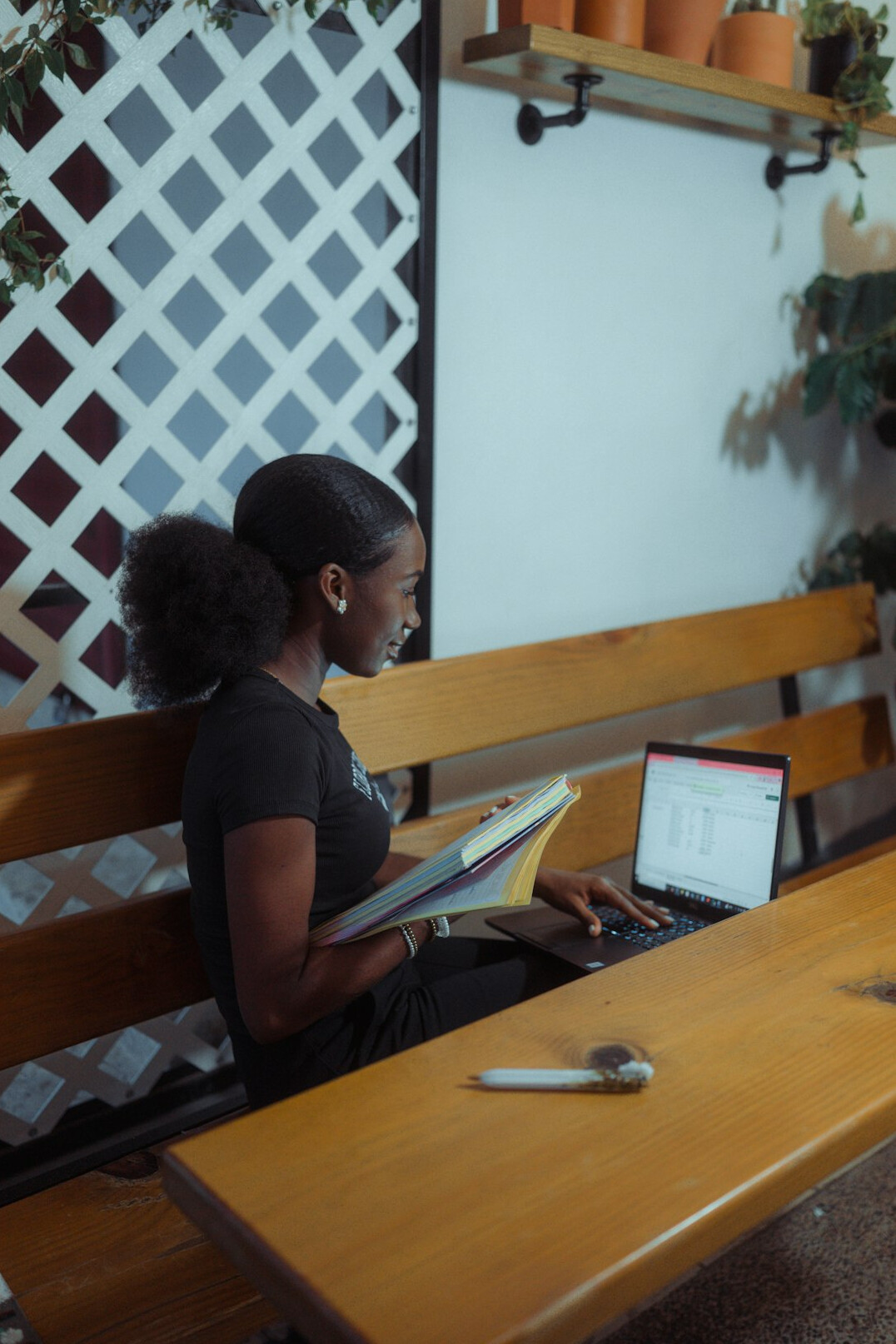 person studying at desk with laptop